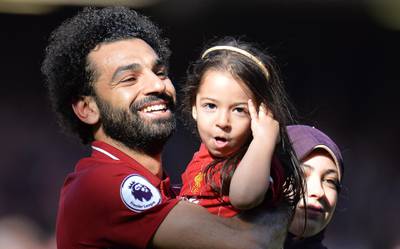 Mohamed Salah celebrates with his daughter Makka and his wife Magi.  EPA