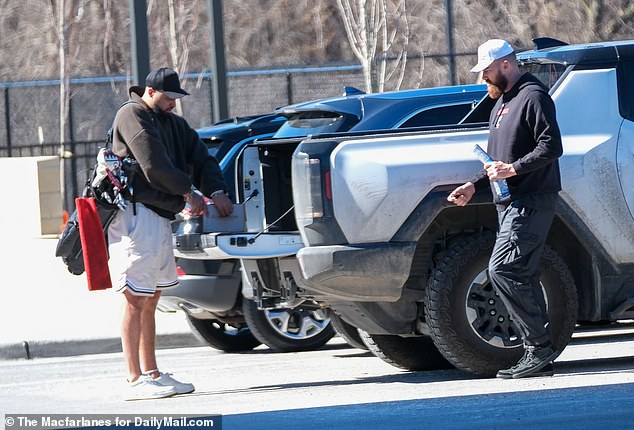 The two friends packed up their equipment, balls, and other items into the back of the souped-up pickup truck before heading out