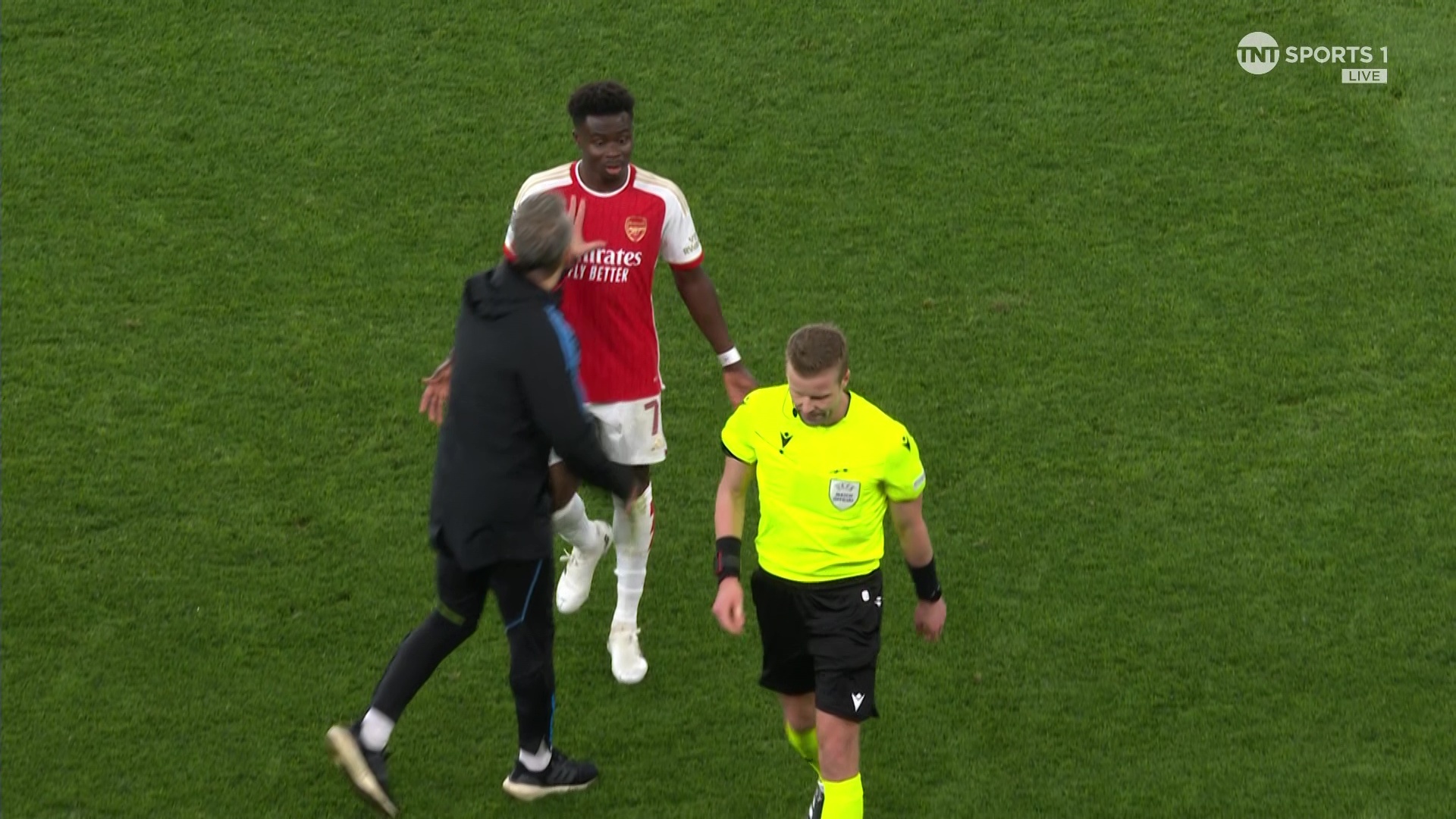 He had to be pushed away by Arsenal's assistant coach