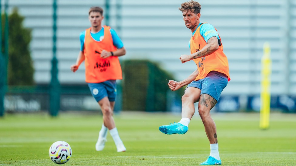 PRECISION : John Stones plays a forward pass. 