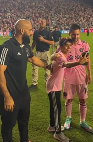 Lionel Messi's bodyguard grabs young fan as he sprints onto field to meet  Inter Miami captain... before letting him get picture and autograph | Daily  Mail Online