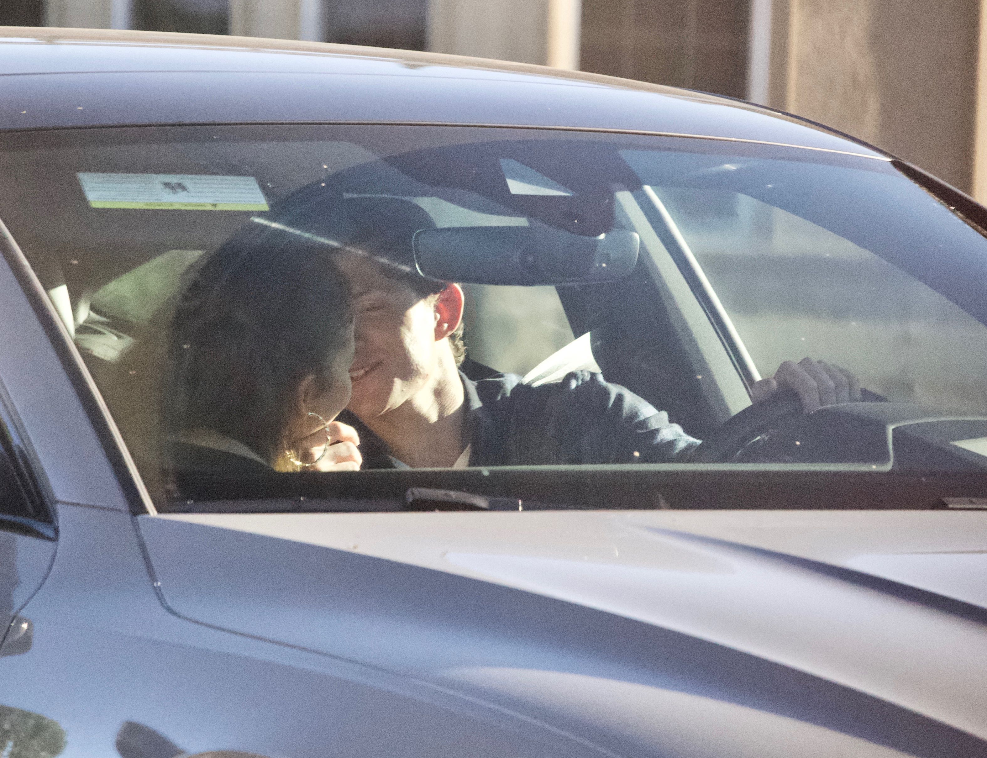 Things heated up between the on-again couple while stopped at a red light