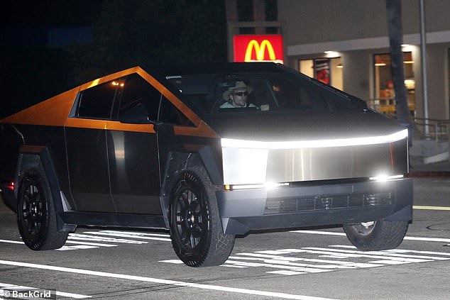 The star wore his sunglasses as he drove Hailey home